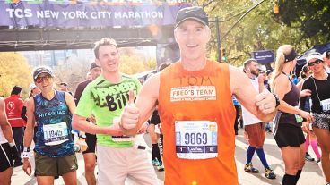 Tom Hansen gives two thumbs up at the finish line of the TCS New York City Marathon.  